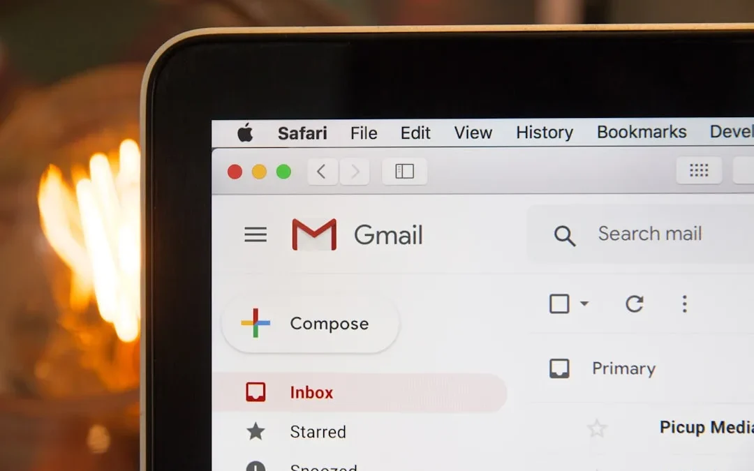 professional replying to an interview invitation email on laptop