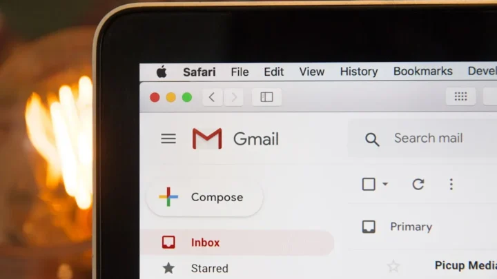 professional replying to an interview invitation email on laptop