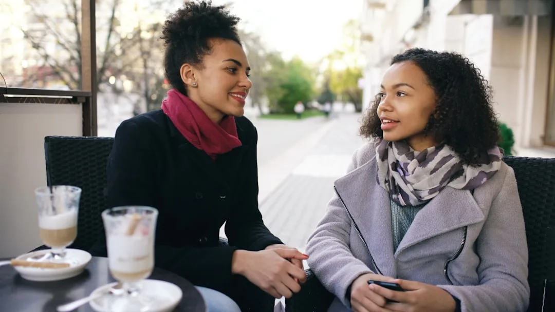 two friends having an honest conversation at a cafe