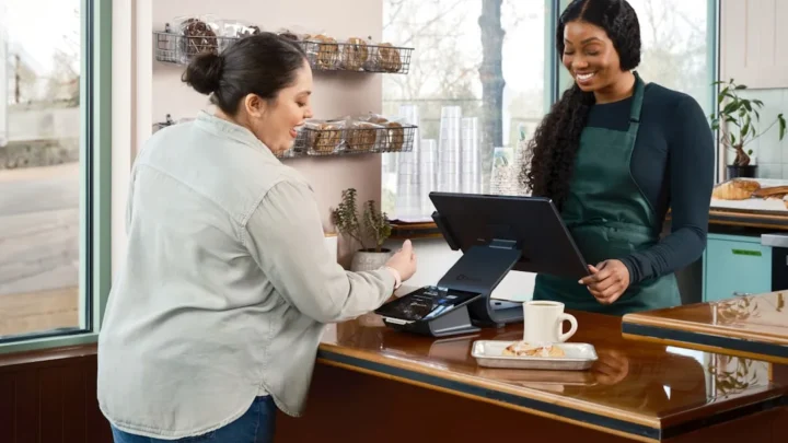 A calm service worker keeping composed while helping a frustrated customer