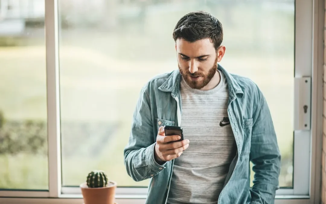 A person sitting calmly and thoughtfully reading a text after some time apart