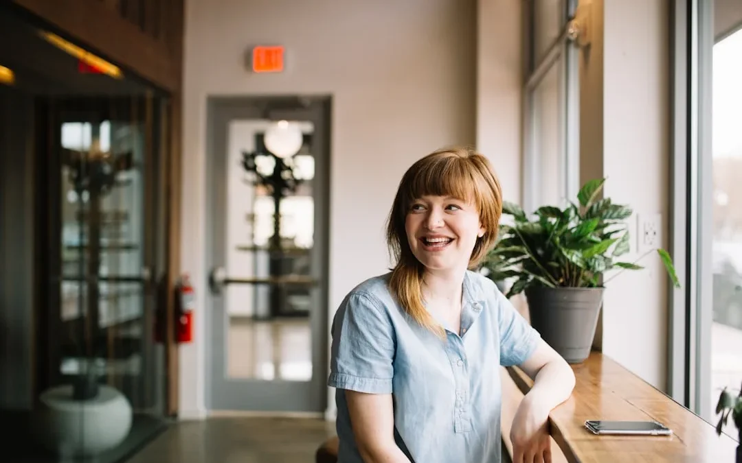 A confident person smiling calmly after being paid a compliment