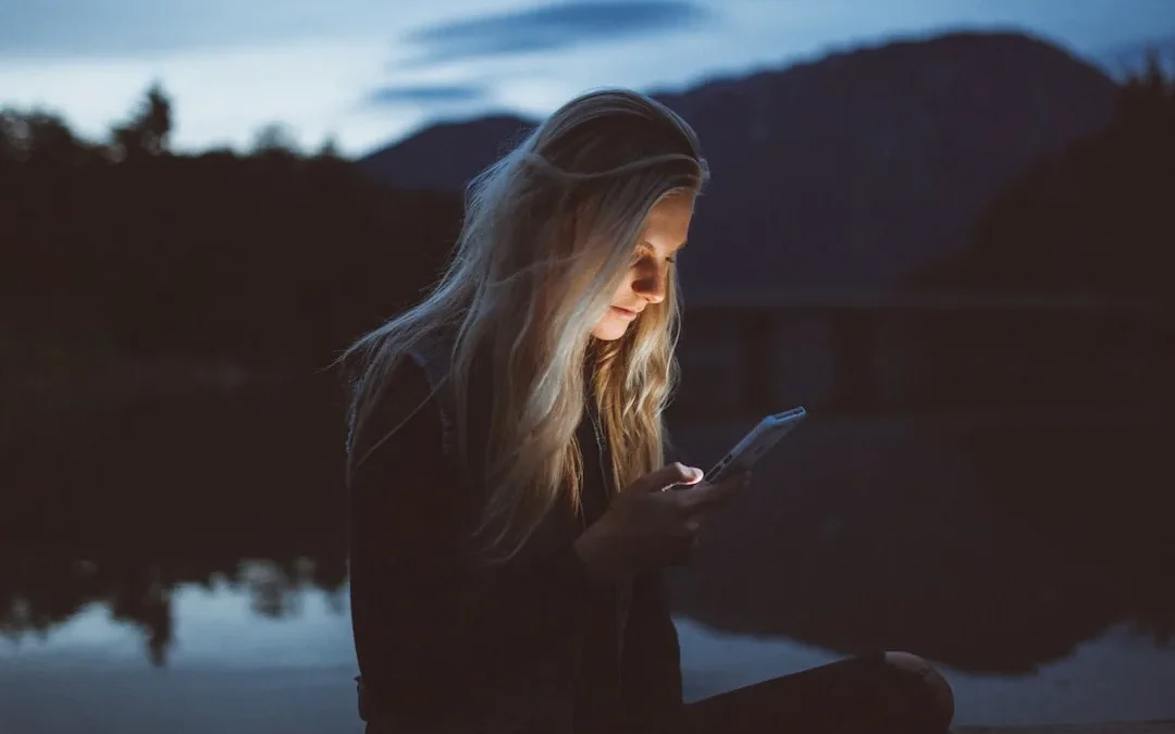 person looking thoughtfully at a read receipt on smartphone
