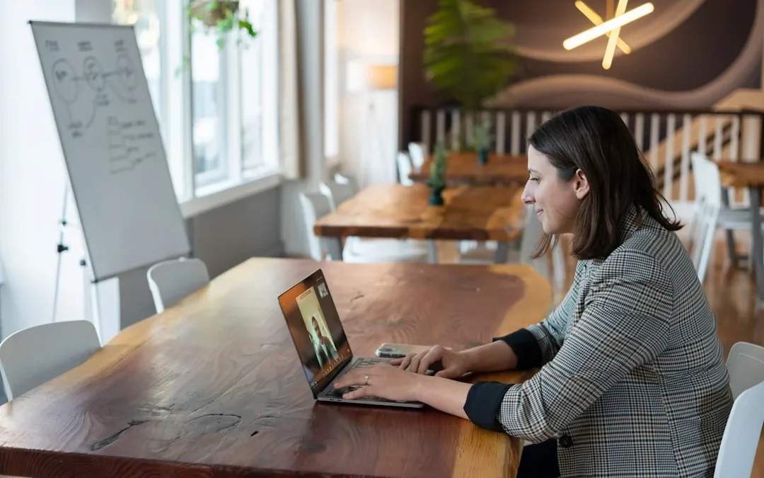 professional reviewing an interview scheduling email at a desk