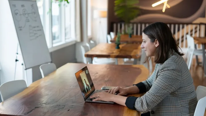 professional reviewing an interview scheduling email at a desk