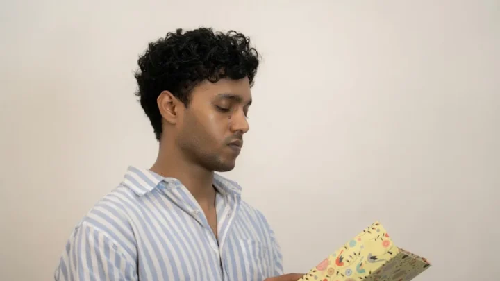 joyful person reading warm birthday messages and cards