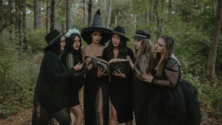 a group of women dressed up in witches costumes