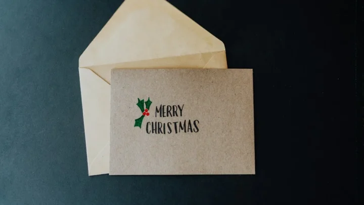 A white envelope with a merry christmas message on it